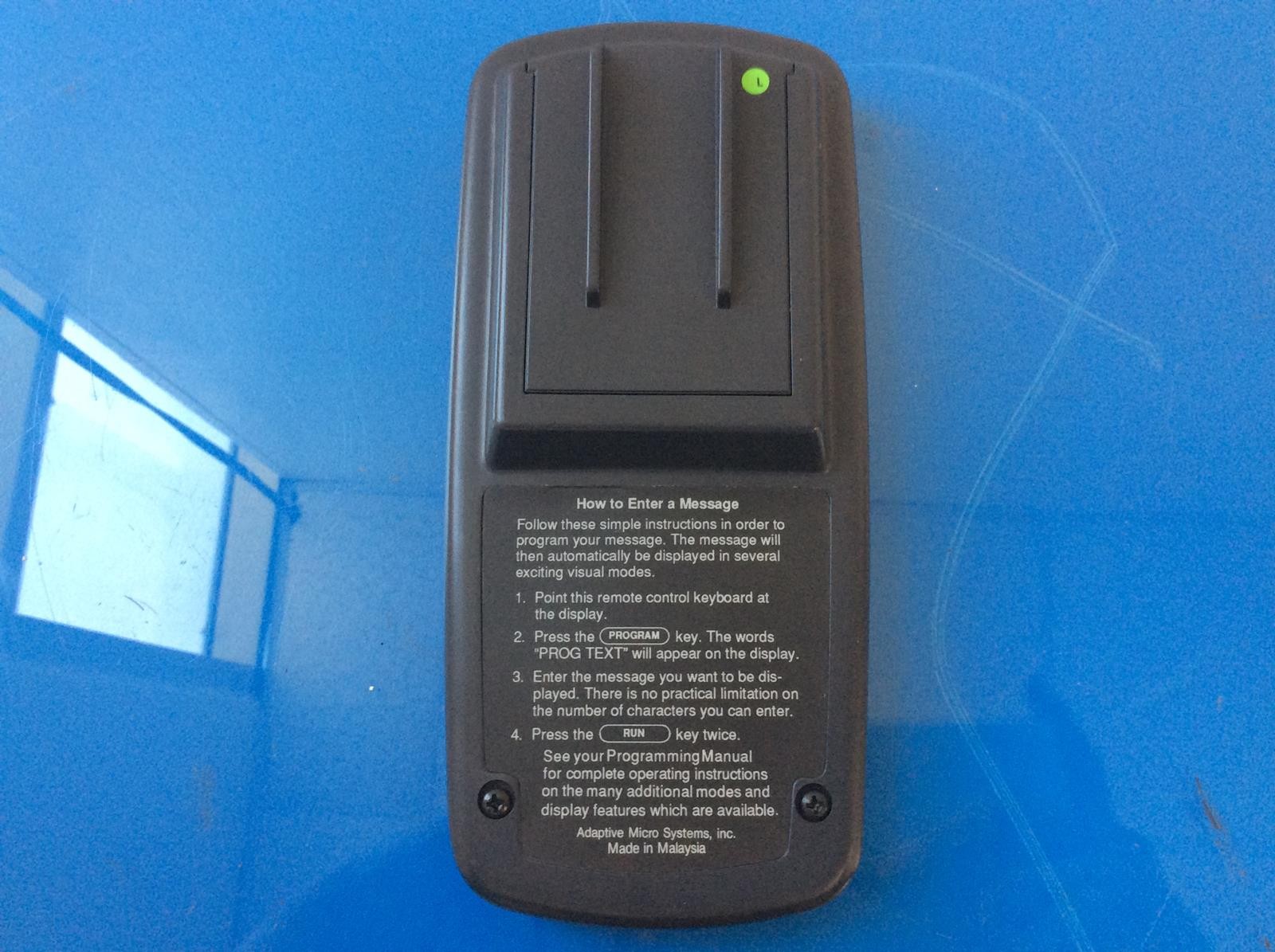 ADAPTIVE MICRO SYSTEMS ALPHA REMOTE FOR SIGN #63407203 BATTERY TESTED