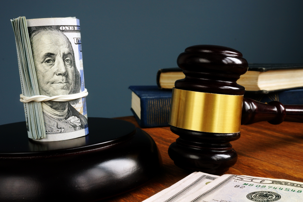 Rolls of money near a court gavel to signify bail